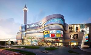 a building with a street in front of it at Chainarong Road in Ban Hua Thale