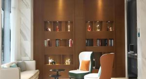 a living room with a book shelf filled with books at City Comfort Inn Wuhan Jinyinhu Garden Expo Park in Wuhan