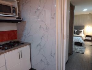 Kuchyň nebo kuchyňský kout v ubytování Hotel Boutique CGH Aeropuerto