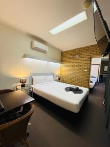 Postel nebo postele na pokoji v ubytování Motel St Arnaud