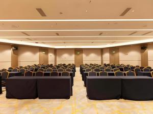 a large room with chairs and tables in it at City Comfort Inn Tai'an Taishan Tianwai Village Hongmen in Tai'an