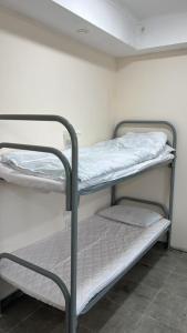 a couple of bunk beds in a room at Lighthouse in Aktau