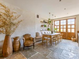 a dining room with a table and chairs at Chantry House in Shoreham-by-Sea