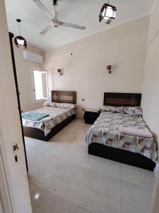 Postel nebo postele na pokoji v ubytování Ramsis resort north coast Alexandria