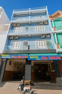 a scooter parked in front of a building at Gia Hoang Hotel in Quy Nhon