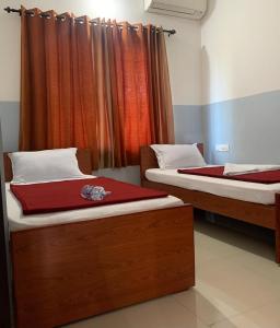 Postel nebo postele na pokoji v ubytování Q8 Hom, hygienic Rooms, Payyoli