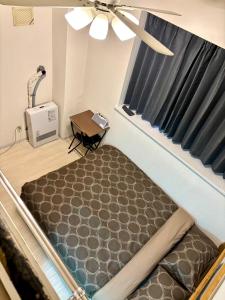 Ένα ή περισσότερα κρεβάτια σε δωμάτιο στο KIYAZA Road Sapporo