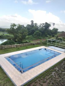 an overhead view of a large swimming pool at Golden Gate Retreats in karanja