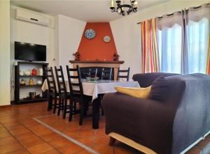 a living room with a table and a couch at Casa Rural Aya I in Linares de la Sierra