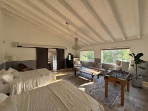 a large living room with two beds and a couch at Hillside Hideaway - Private Woodland Hills Canyon Suite in Woodland Hills