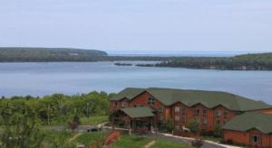 an aerial view of a building with a lake at Holiday Inn Express Munising-Lakeview Hotel By IHG in Munising