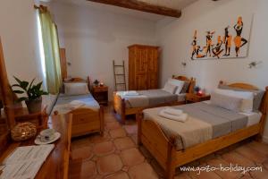 Ένα ή περισσότερα κρεβάτια σε δωμάτιο στο Orchidea Xaghra