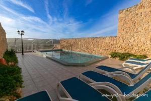 Πισίνα στο ή κοντά στο Orchidea Xaghra +18 φωτογραφίες