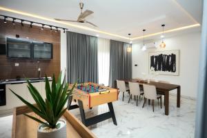 a dining room with a table and a chess board at Villa Hills Hotel 