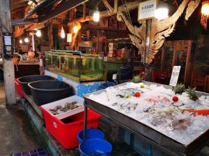a fish market with a table with food on it at Successive BeachFront ,Krabi in Ban Khlong Haeng