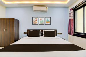 Postel nebo postele na pokoji v ubytování Hotel O S-Square + 22 fotografií