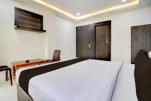 Postel nebo postele na pokoji v ubytování Hotel O S-Square