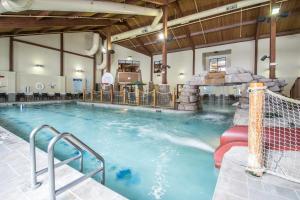 a large swimming pool with a water slide at Bluegreen Vacations Christmas Mountain Village, an Ascend Collection Resort in Wisconsin Dells