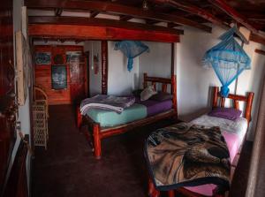 a bedroom with two beds in a room at The paulwood cabana and Bungalow in Nuwara Eliya