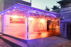 a stage with purple lights in a building at RedDoorz near Juwata 3 Airport Tarakan in Karanganyar