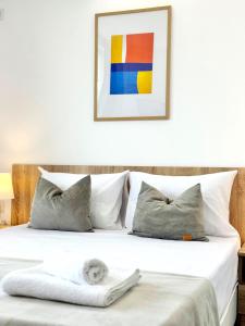 a bedroom with a bed with a towel on it at Студия за нощувки - Стара Загора in Stara Zagora