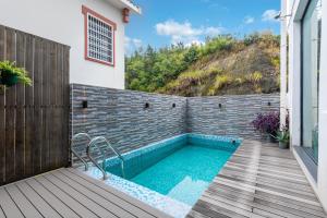 a swimming pool on a deck with a house at Heaven's Gate Lodge XMAN-Free pick up in Zhangjiajie