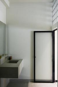 a bathroom with a sliding door in a room at Nova Surf House in Matara +42 photos