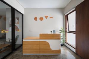 an office with a wooden desk and a window at Cove Heritage in Binong +12 photos