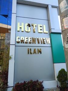 a sign for a hotel greenheim hall at Hotel Green View in Ilām