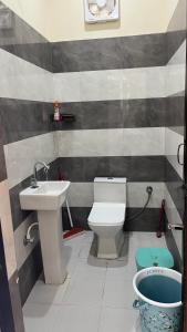 a bathroom with a sink and a toilet at Msk Hotel & Restaurant in Jāmb +36 photos