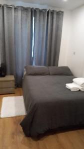 Postel nebo postele na pokoji v ubytování Espaço Realeza + 1 fotografie