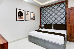 Postel nebo postele na pokoji v ubytování Hotel O Apple Grand