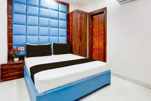 Postel nebo postele na pokoji v ubytování Hotel O Apple Grand