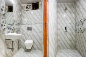 Koupelna v ubytování Hotel O Apple Grand