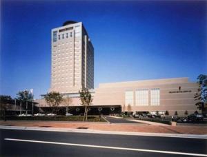 ŌjimachiにあるGrand Hotel New Ojiの大きな白い建物