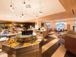 a restaurant with a buffet line with food on display at Yuzawa New Otani in Yuzawa