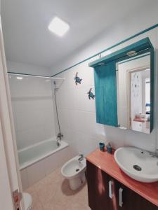a bathroom with a sink and a toilet and a tub at Sal Marina in Puertito de Güímar