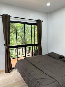 Ένα ή περισσότερα κρεβάτια σε δωμάτιο στο The Summer Cozy Cottage