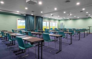 a conference room with tables and chairs in it at Thon Hotel Verdal in Verdal