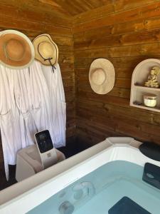 a bathroom with a tub with a cell phone in it at Grande Villa au vert à 1h de Paris #reveillon #31 #seminaire in Treuzy-Levelay