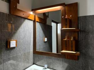 a bathroom with a sink and a mirror at Ella Nest View Homestay in Ella