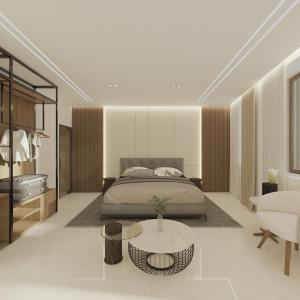 Un dormitorio con una cama y una mesa de café. en The Wine Suites, en Rodas