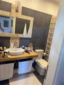 a bathroom with a sink and a toilet at Villa Odymar Ammouliani in Ammouliani