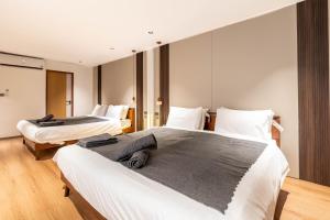 Postel nebo postele na pokoji v ubytování In Vogue Sukhumvit 57 Branded Suite + 64 fotografií