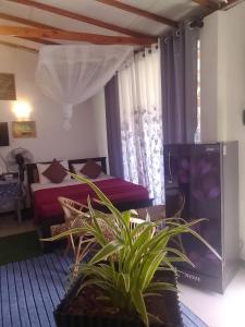 Giường trong phòng chung tại Ella Black Bridge View Cottage Sri Lanka