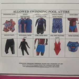 a poster ofswimmingpool attire on a wall at Rich Return Empire in Gua Sai