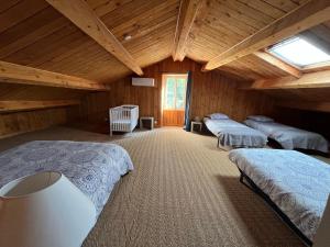 a room with three beds in a wooden cabin at Domaine Du Castellas in Saint-Raphaël +11 photos