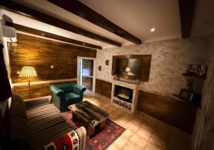 a living room with a couch and a fireplace at Retreat Cameroon BASTOS in Yaoundé