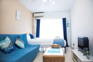 Una televisión o centro de entretenimiento en オーシャンビューハウス美ら海