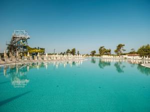 a large pool of water with a roller coaster at Zaton Holiday Resort in Nin